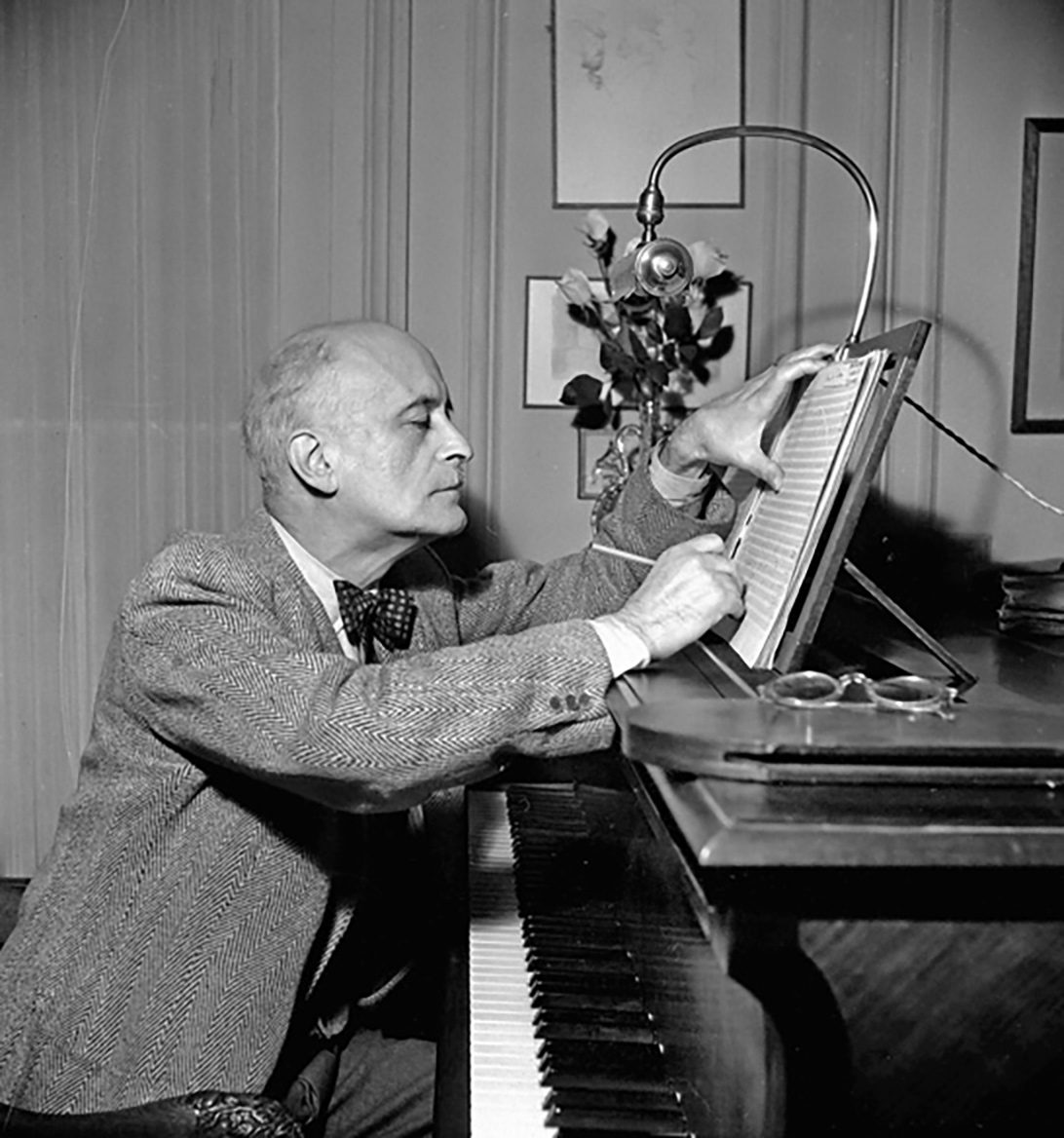 Jacques Ibert composing at the piano